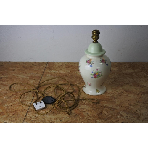 556 - A floral patterned pottery lamp base.