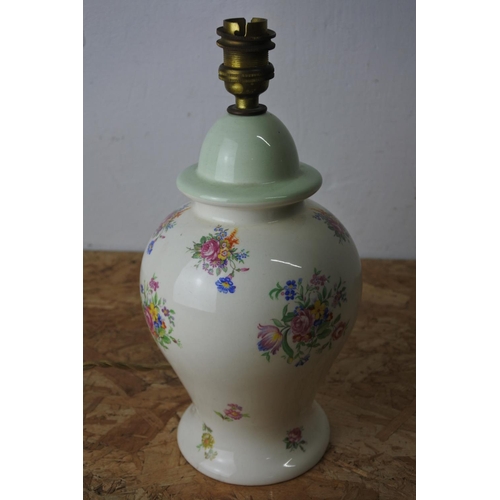 556 - A floral patterned pottery lamp base.