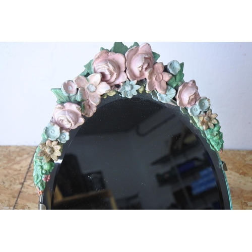 559 - A floral table mirror.