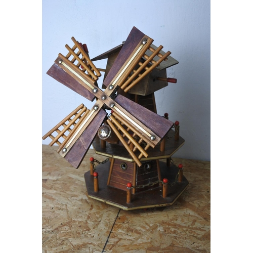 579 - A wooden windmill. (a/f)