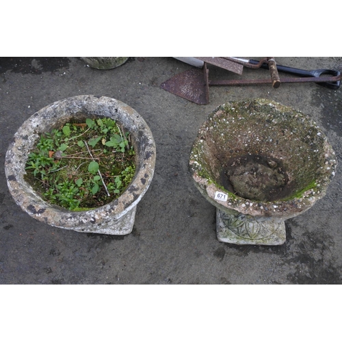 671 - A pair of large concrete garden planters.