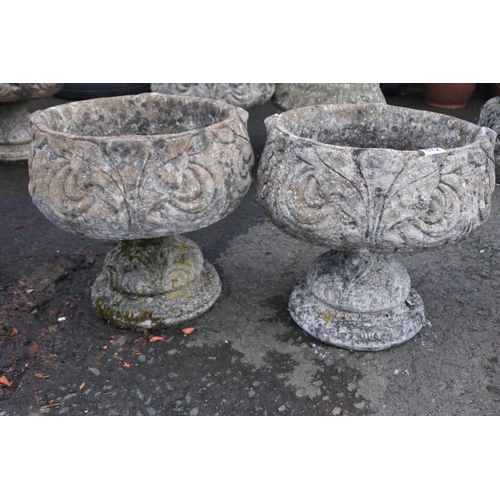 672 - A pair of large concrete garden planters.