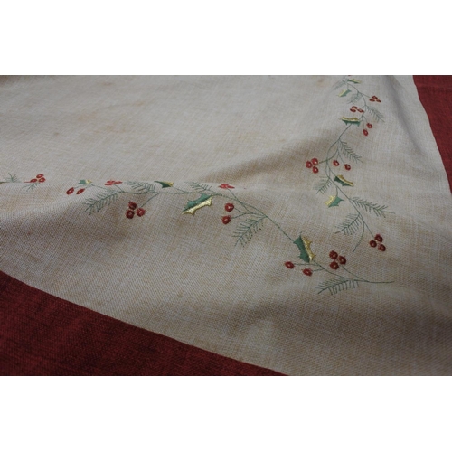 678 - A Christmas themed linen table cloth.