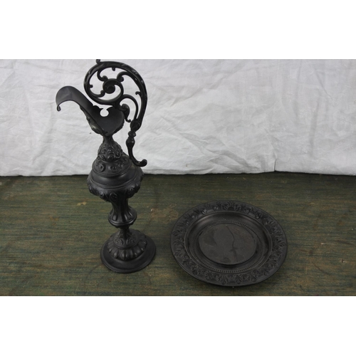 689 - A stunning ornate metal vase and stand.