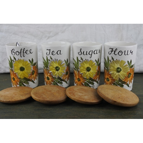 717 - A set of four vintage Crown Devon 'Fieldings' tea, coffee, sugar and flour ceramic and wood canniste... 