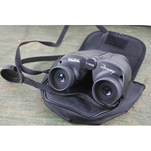 724 - A cased Halina Discovery 7-15 x 25 set of binoculars.