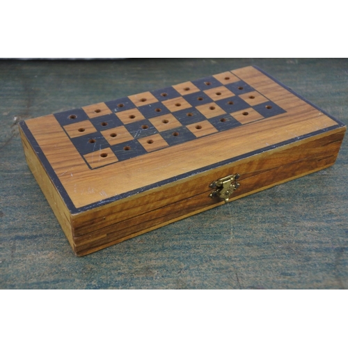 725 - A miniature wooden cased chess set.