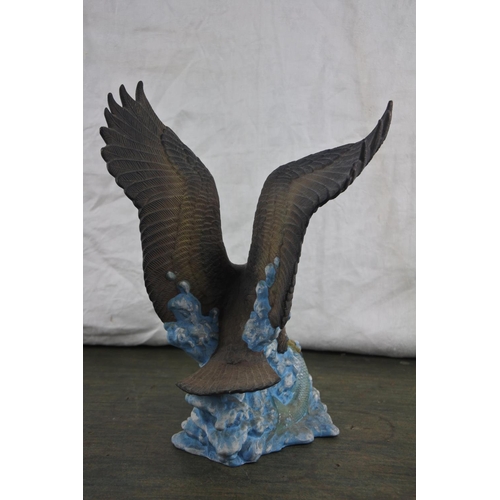 729 - An ceramic figure of an eagle.