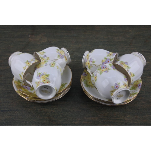 735 - A 12 piece floral pattern coffee set.