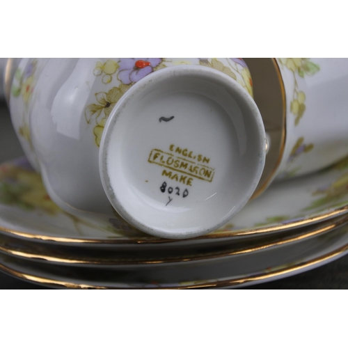 735 - A 12 piece floral pattern coffee set.