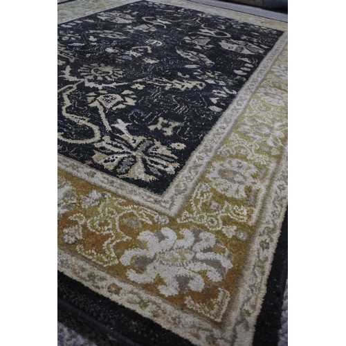 742 - A Ziegler pattern floor rug measuring 120 x 170.