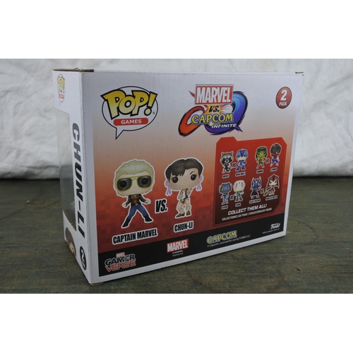 746 - A boxed Pop Games two pack character set 'Captain Marvel and Chun-li'.