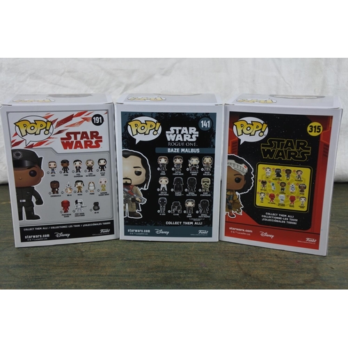 764 - Three boxed Marvel Pop Games characters 'Finn, Baze Malbus and Jannah'.