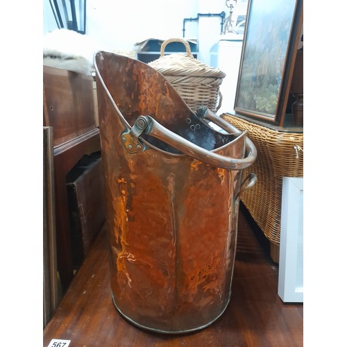 566 - A stunning large antique copper coal bucket.