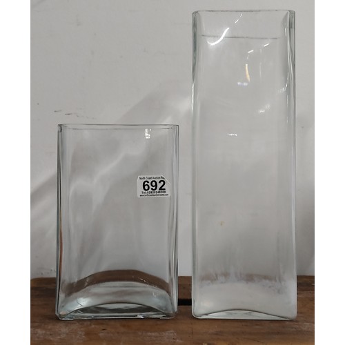 692 - Two square glass vases (a/f).