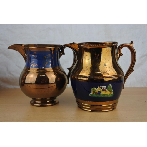 44 - Three antique lustre jugs.