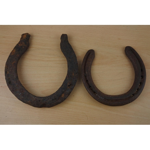 45 - Two vintage horse shoes.