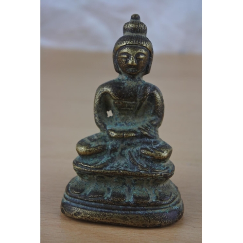 48 - A brass Buddha figure.
