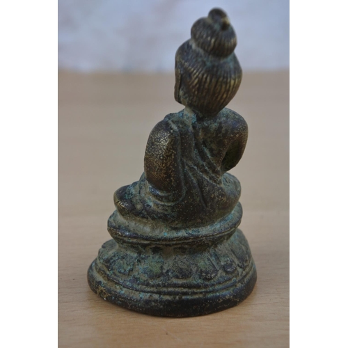 48 - A brass Buddha figure.
