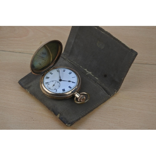 640 - A gold plated pocket watch and pouch.