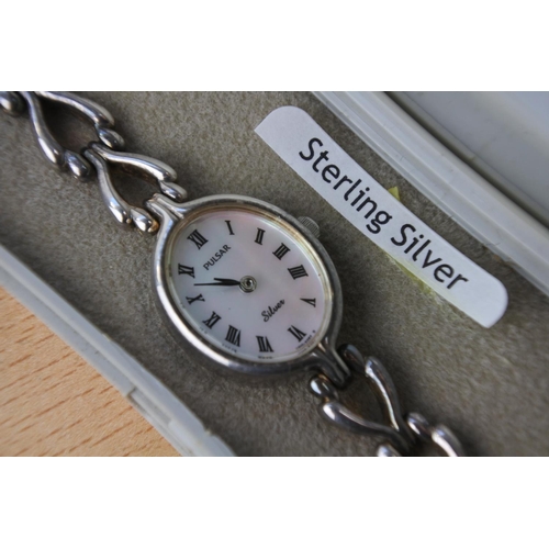 649 - A boxed sterling silver Pulsar watch.