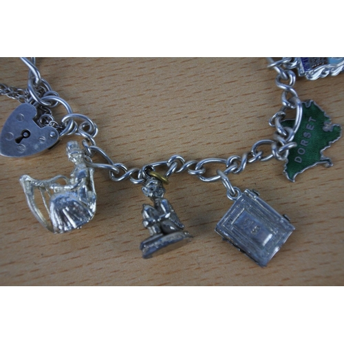 591 - A stunning sterling silver charm bracelet.