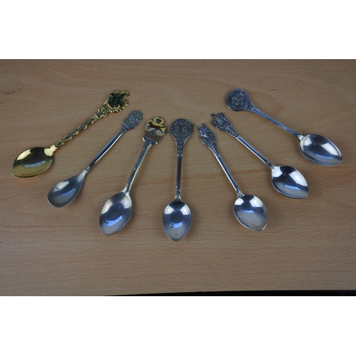 596 - A collection of seven Boy Scout EPNS spoons and more.