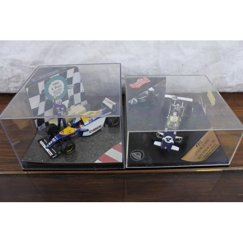 56 - A cased Vitesse limited edition 1993 A Prost Williams Renault FW15B and a cased Quartzo 4013 Lotus 4... 