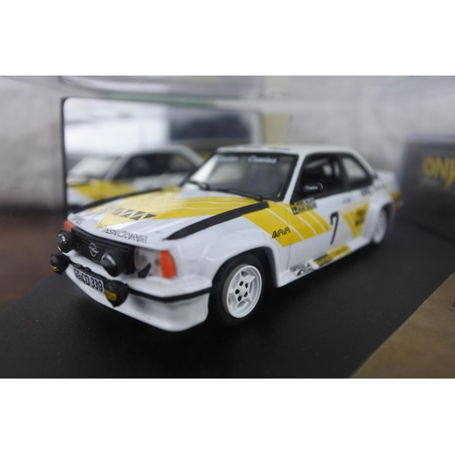 57 - A cased Vitesse limited edition L174B opel Ascona 400 and a cased Onyx 287 Forti Ford Luca Badoer.