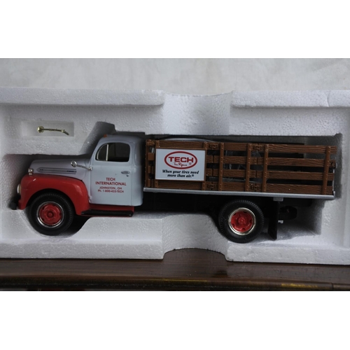 77 - A boxed First Gear 1951 Ford F-6 full rack stake truck scale 1:34.