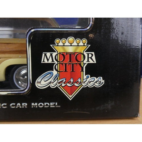 114 - A boxed Motor City Classics 1949 Ford Woody Wagon 3002 scale 1:18.