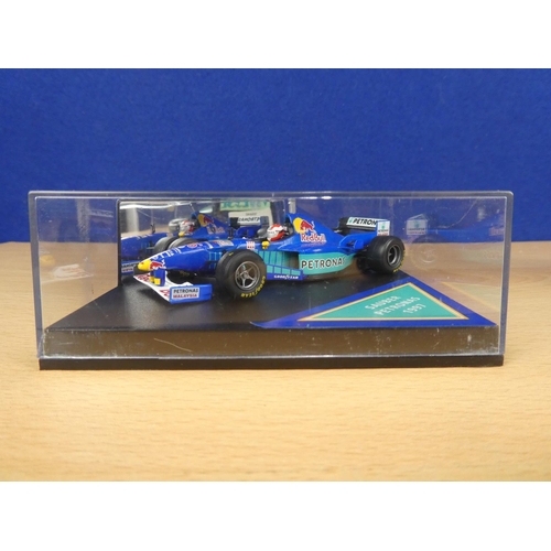 129 - A cased Red Bull Sauber Petronas 1997 Formula One cars, racing driver Johnny Herbert and a cased Vit... 