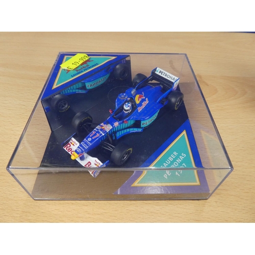 130 - A cased Red Bull Sauber Petronas 1997 Formula One cars, racing driver Nicola Larini and a cased Quar... 