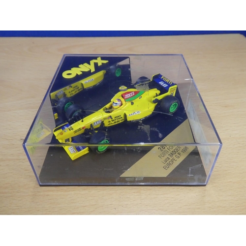 131 - A cased Red Bull Sauber Petronas 1997 Formula One cars, racing driver Johnny Herbert and a cased Ony... 