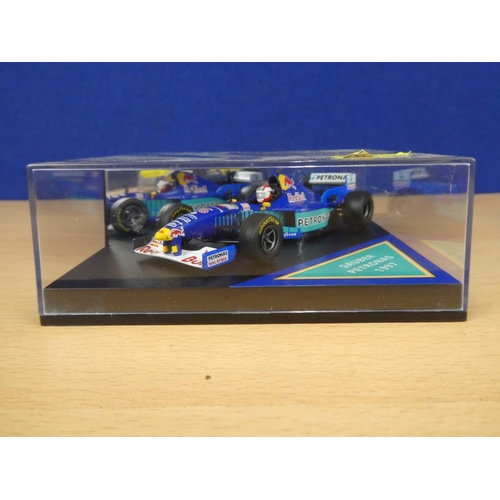 131 - A cased Red Bull Sauber Petronas 1997 Formula One cars, racing driver Johnny Herbert and a cased Ony... 