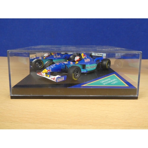 133 - A cased Red Bull Sauber Petronas 1997 Formula One cars, racing driver Johnny Herbert and a cased Qua... 