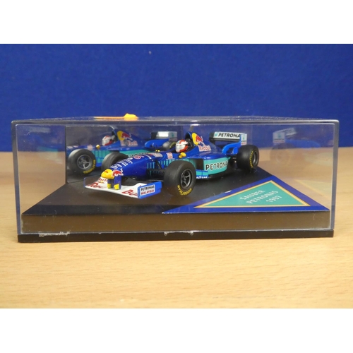 137 - A cased Red Bull Sauber Petronas 1997 Formula One cars, racing driver Johnny Herbert and a cased Ony... 