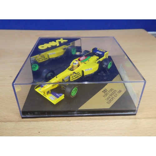 138 - A cased Red Bull Sauber Petronas 1997 Formula One cars, racing driver Johnny Herbert and a cased Ony... 