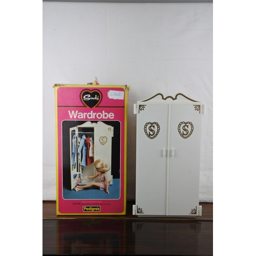 349 - A complete and boxed Sindy Wardrobe.