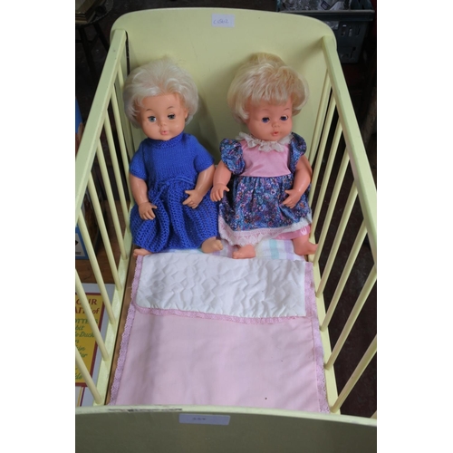 354 - An old toy doll's cot with 2 Palitoy Tiny Tears Dolls