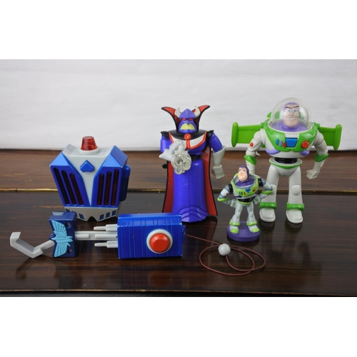 356 - A working Buzz Lightyear motorbike, poster and other toys.