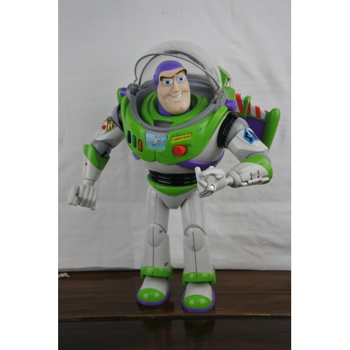 356 - A working Buzz Lightyear motorbike, poster and other toys.