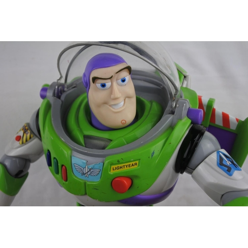 356 - A working Buzz Lightyear motorbike, poster and other toys.