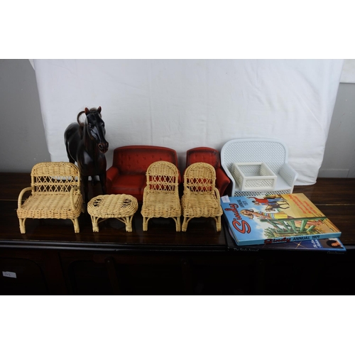 361 - A lot of Various Sindy doll furniture includes 2 sofas, a chair, a table and a wicker patio set.