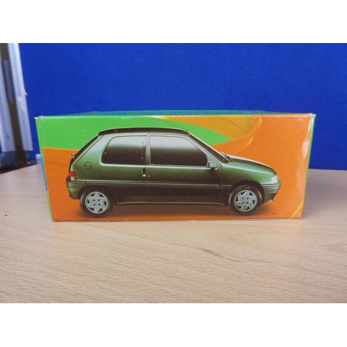 314 - A boxed Vitesse Peugeot 106 car (a/f) and a boxed Kaden Skoda Octavia.