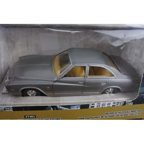 297 - A Corgi 'Kojak' Buick with a Whiit metal figurine.