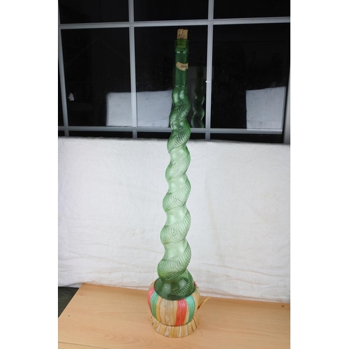 71 - A large vintage glass Genie bottle. Approx 87cm.