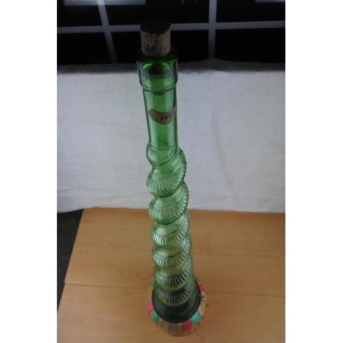 71 - A large vintage glass Genie bottle. Approx 87cm.