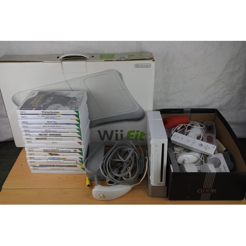 74 - A Nintendo Wii console, games, controllers and more.