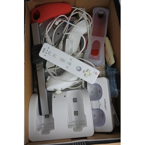 74 - A Nintendo Wii console, games, controllers and more.